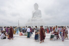 Devotees worship Maravijaya Buddha Image